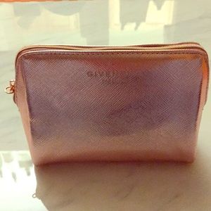 Brand new Givenchy gold make up case.